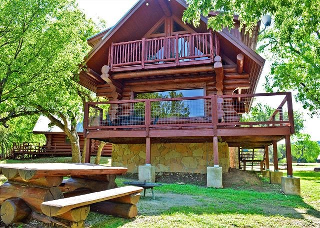 Cabin exterior, picnic table.